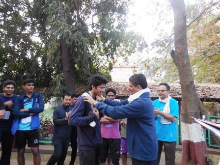 Prof. Soman giving medal to a winner